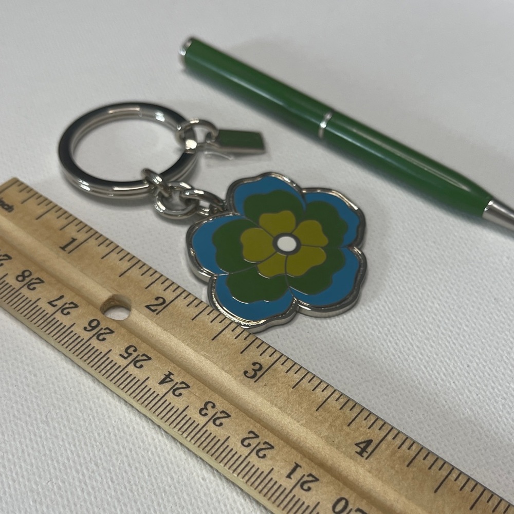 Green and Blue Floral Keychain by Coach and a Green Coach Pen - Picture 3 of 5
